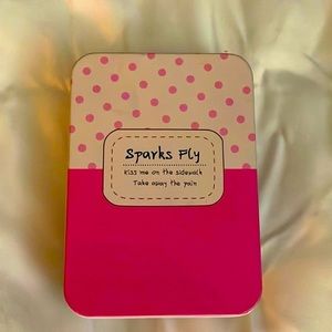 Pink polka dot tin container “kiss me from the sidewalk and take away the pain”
